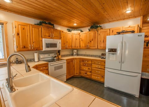 Well stocked kitchen with large refrigerator. Perfect for big groups or multiple families.