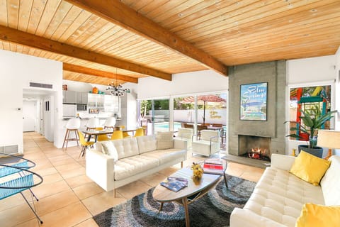 Classic midcentury post and beam ceilings and walls of glass