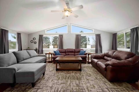 Large living room with huge windows let in the natural light