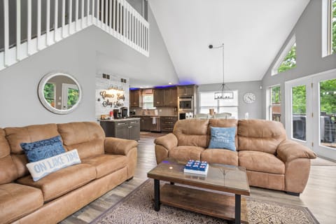 Great room with 3 couches and Smart TV