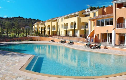 Lounge by the pool in the sunshine.
