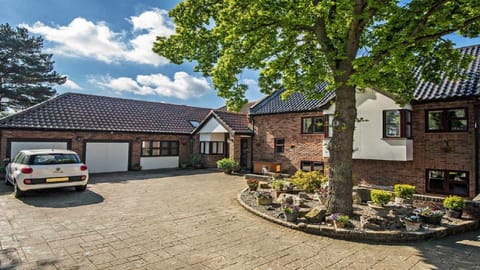 Generous parking area for up to 5 cars