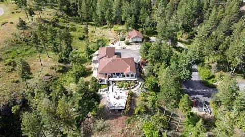Drone view of our home and cottage rental in the background.