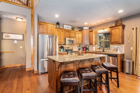 The open-concept kitchen is the perfect gathering place before meals!