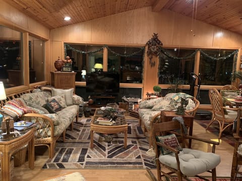 Sunroom sitting & lounging area. TV, DVD & VHS