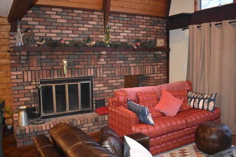 Living Room with wood burning fireplace.
