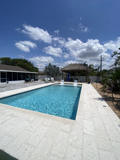 Large yard with tiki hut