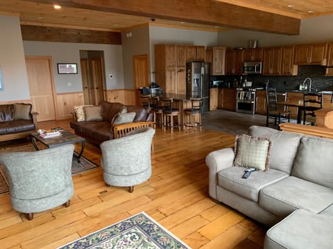 Beautiful kitchen with bar and kitchen table seating opens to great room.
