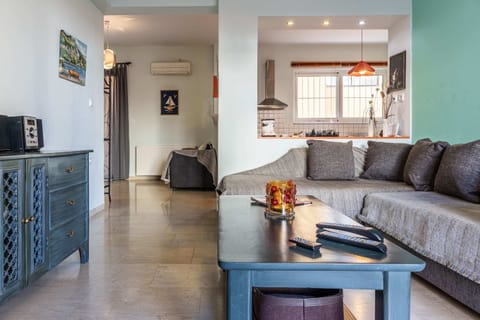 Spacious Living Area with Natural Light and Dual Seating
Main living space includes a second sofa, ideal for larger groups or families to relax together comfortably.