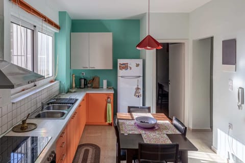 Airy Dining Room Connected to Kitchen
A bright and colorful space for shared meals, directly adjacent to the kitchen for convenience.