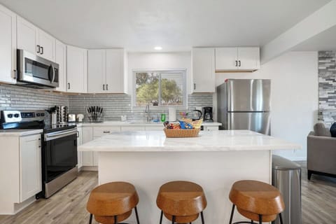 Fully stocked kitchen with countertop for easy meal preparation.