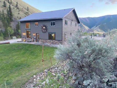 view of the cabin from the outside and lawn.