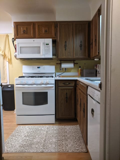 Chef stove, microwave, and built in dishwasher.