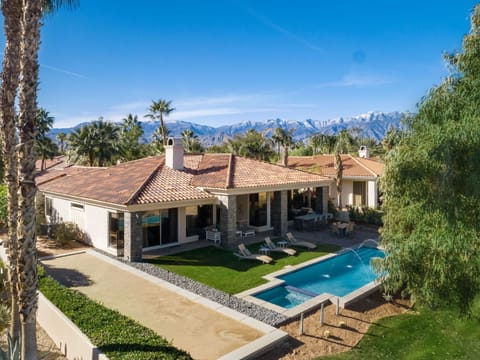 Rear view with Bocce Ball court on left and lap pool and spa facing out to golf 