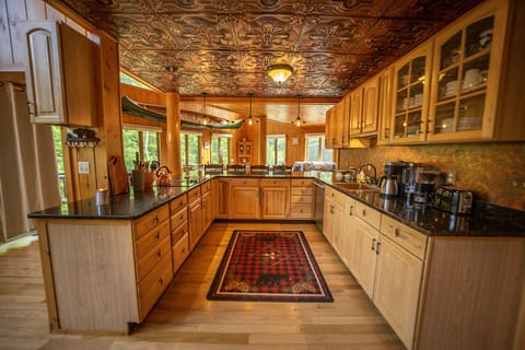 Kitchen with copper sink, 2 cooktops, Stainless appliances, convec/microwave 