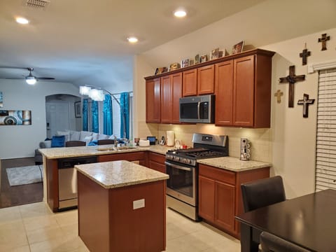 Kitchen island with view of Living room 