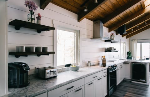 Spacious kitchen with plenty of prep space, oven, microwave, dishwasher & more.