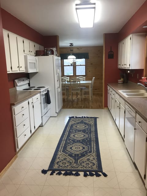 Large Kitchen with modern appliances and cookware.