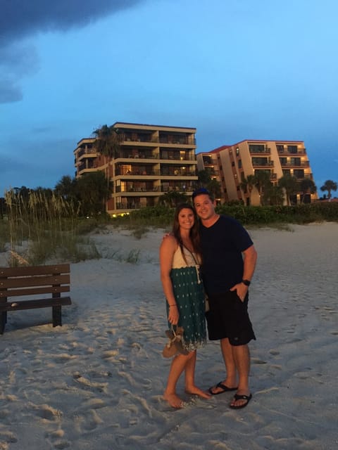 Building left of couple. 