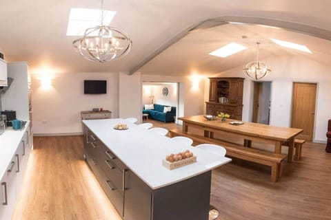 Kitchen Diner and small seating area. Access to all four bedrooms and the lounge.