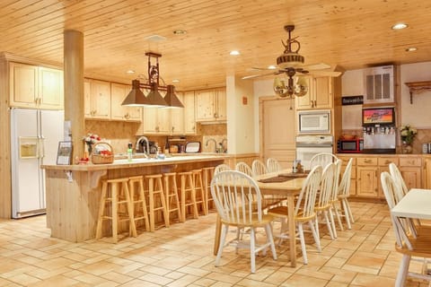 Full-sized table fits up to 10 chairs, two 5- foot diameter round foldable tables seating another 8-10 each can also be used.