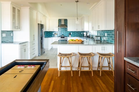 Grab a stool at the kitchen breakfast bar.