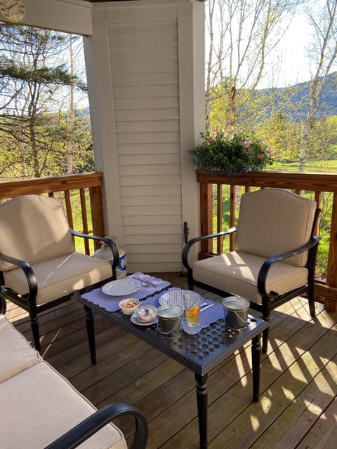 Relax on the deck overlooking the first hole on Haystack Golf Course