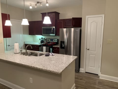 Kitchen with stainless steel appliances .