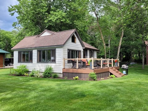 Lakeside view of the cabin features 2 large picture windows.