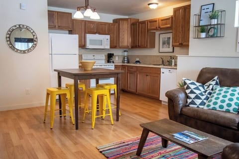 Table with seating for 4. Pulls out to accommodate more people. Extra seating in garage.