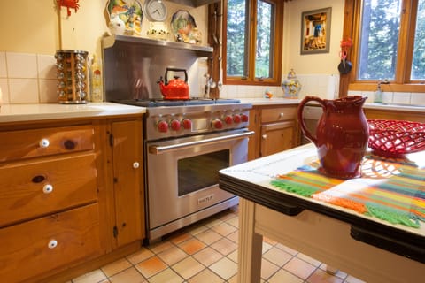 Six Burner WOLF Stove. Kitchen with full Chef appliances, cutlery, pots/pans