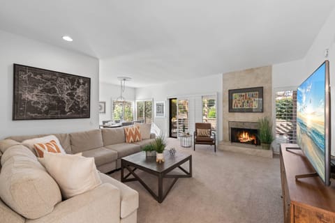 Cozy Living Room with Smart TV & Fireplace