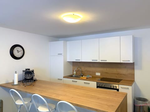 Furniture, Interior Design, Countertop, Flooring, Wall, Wood, Kitchen, Cabinetry, Ceiling, Floor