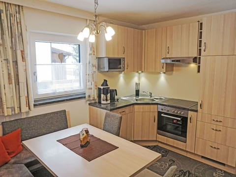 Furniture, Wood, Interior Design, Flooring, Countertop, Floor, Kitchen, Room, Lighting, Kitchen Appliance