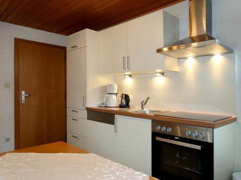 Cabinetry, Countertop, Furniture, Building, Property, Wood, Drawer, Kitchen, Interior Design, Kitchen Stove