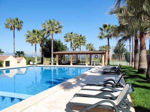 Water, Plant, Sky, Property, Building, Tree, Swimming Pool, Outdoor Furniture, Shade, Arecales