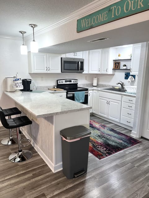 Full kitchen with many cooking tools.