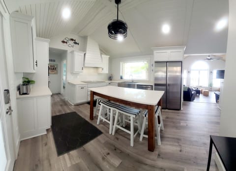 Fully equipped kitchen with seating for six at the island table. 