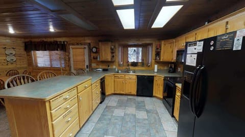 Kitchen comes equipped with a fridge, oven, microwave, and a dishwasher. It is also equipped with dishes, silverware, and basic cooking essentials.