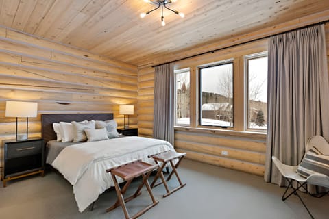 Unwind in crisp linens and calm, sunlit mountain views.