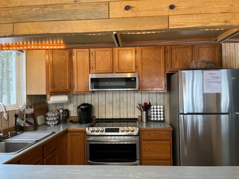 Stainless steel appliances. Electric stove and kettle, Keurig coffee machine