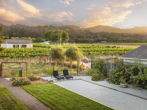 Yard with bocce, hot tub, and spots to dine and relax!