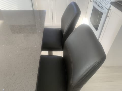 A LOVELY WORK STATION ON YOUR LARGE KITCHEN ISLAND WITH LEATHER, SWIVEL CHAIRS! 