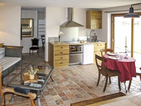 Cabinetry, Furniture, Table, Countertop, Kitchen, Wood, Drawer, Chair, Flooring, Lighting