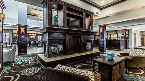 Settle into the lobby lounge with warm wood accents and deep leather seating