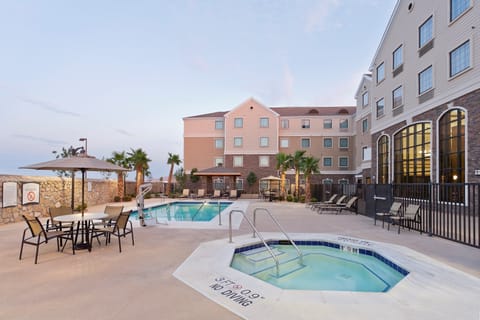 Lounge by the pool in the sunshine.