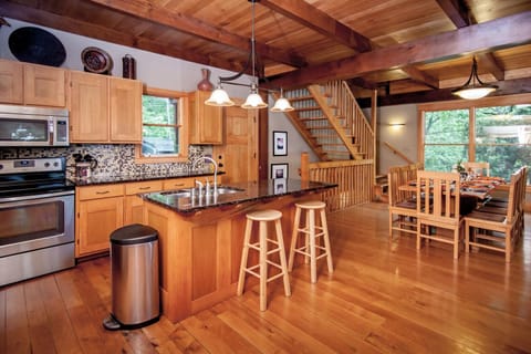 Open floor plan with stainless steele appliances, dishwasher, coffeemaker, etc.