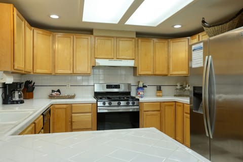 POV of kitchen from the bar at the rental unit