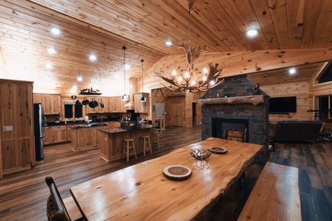Dining room, kitchen and double sided fireplace