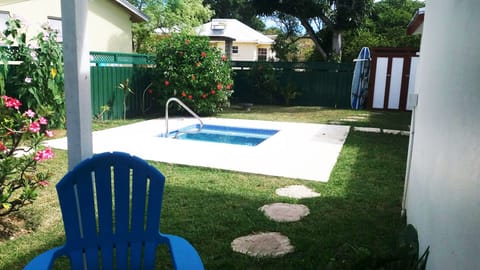 View from private patio to shared tropical garden and small plunge pool.